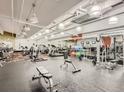 Bright gym equipped with treadmills, weights, and exercise balls, featuring mirrors and rubber flooring at 101 S Eola Dr # 1119, Orlando, FL 32801