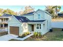 Charming two-story home featuring a well-manicured lawn at 1039 Morningside Dr, Eustis, FL 32726