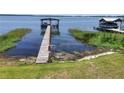 Picturesque lake view with a private dock, offering direct access to the water at 2929 Lakeshore Dr, Mount Dora, FL 32757