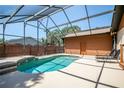 Enjoy a private screened-in pool area, perfect for relaxation and outdoor enjoyment at 2929 Lakeshore Dr, Mount Dora, FL 32757