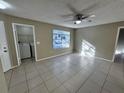 Bedroom featuring a ceiling fan, closet, and natural light from the window at 629 Dory Ln # 202, Altamonte Springs, FL 32714