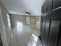 Living room showcasing the tile flooring, ceiling fan, and open layout at 629 Dory Ln # 202, Altamonte Springs, FL 32714