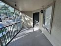 A screened in porch with a view looking out towards the parking area at 629 Dory Ln # 202, Altamonte Springs, FL 32714