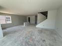 Large, open living room with unfinished floors showcasing the home's spacious layout and natural light at 726 Pointe Emerson Blvd, Apopka, FL 32703