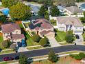 Beautiful two-story home with a screened-in pool area, solar panels and a well-maintained lawn at 1243 Osprey Way, Apopka, FL 32712