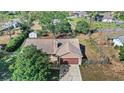 Aerial view of a single-Gathering home with a fenced backyard, mature trees, and a two-car garage at 17445 Hillside Dr, Montverde, FL 34756