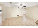 Bright living room with tile flooring and ceiling fan at 996 E Normandy Blvd, Deltona, FL 32725