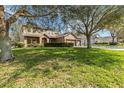 Beautiful two-story house with a paved driveway and a well-maintained lawn at 1037 Truffles Ct, Apopka, FL 32712