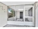 Cozy screened-in porch with a view of the yard and access to the house at 1202 Ferndell Rd, Orlando, FL 32808