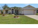 Charming single-Gathering home with a two car garage, meticulous landscaping, and lovely palm trees at 1646 Arash Cir, Port Orange, FL 32128