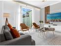 Tastefully decorated living room boasts contemporary furnishings, a sleek TV setup, and elegant décor at 2945 Simile St, Kissimmee, FL 34746