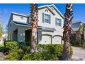 Two-story home showcasing lush landscaping, a two-car garage, and a well-maintained facade at 3270 Mt Vernon Way, Kissimmee, FL 34741
