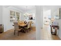 Dining room with a wooden table, decor, and many chairs at 390 Miro Dr, Davenport, FL 33837