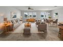 This well-lit living room has lovely decor and an amazing water view at 5323 Rochester Pl, St Cloud, FL 34771