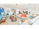 Open-concept living area with stylish decor and plenty of natural light at 537 Marcello Blvd, Kissimmee, FL 34746