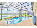 Gorgeous pool with a hot tub and lake view, perfect for relaxation and entertaining at 537 Marcello Blvd, Kissimmee, FL 34746