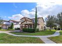 Charming two-story home with a well-manicured lawn and two-car garage at 15672 Shorebird Ln, Winter Garden, FL 34787