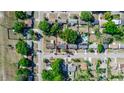 Aerial view of a property with a red outline, showcasing its location and surrounding neighborhood with mature trees at 5508 Meridian Way, Orlando, FL 32808