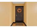 Inviting black front door with seasonal wreath, creating a warm and welcoming entryway at 911 N Orange Ave # 148, Orlando, FL 32801