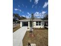 A single Gathering home with a driveway, window and manicured lawn at 1007 Colyer St, Orlando, FL 32805