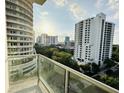 View of city buildings from condo balcony with glass railing at 101 S Eola Dr # 921, Orlando, FL 32801