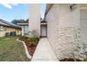 Close up front entry with landscaped walkway and charming facade at 1188 La Mesa Ave, Winter Springs, FL 32708