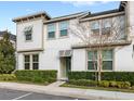 Attractive two-story townhome showcasing a tidy front yard at 1547 Carey Palm Cir, Kissimmee, FL 34747