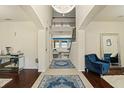 Bright foyer with high ceilings, chandelier, and view into the formal living area at 2926 Falconhill Dr, Apopka, FL 32712