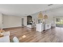 Spacious living area connecting a stylish island kitchen with a cozy seating area at 4520 Lake Gem Cir, Orlando, FL 32806