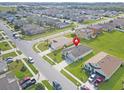 Neighborhood aerial view showcasing the property's location within a residential community and well-maintained landscaping at 5590 Forest Ridge Dr, Winter Haven, FL 33881