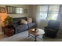 Comfortable living room with a neutral color palette, lots of light and stylish furnishings at 1306 Pedro Ct, The Villages, FL 32159