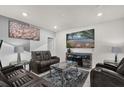 Comfortable living room featuring modern decor, a plush rug, and a large screen television for entertainment at 2234 Bluebird Pl, St Cloud, FL 34771