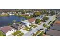 Beautiful aerial view of a residential neighborhood and the lake at 2263 Mallard Creek Cir, Kissimmee, FL 34743