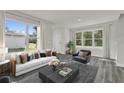 Bright living room with large windows, stylish furniture, and elegant decor at 495 Dean Creek Ln, Orlando, FL 32825