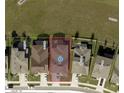 An aerial view shows the property's location in a residential neighborhood with well-maintained lawns and nearby houses at 7035 Oxbow Rd, Minneola, FL 34715