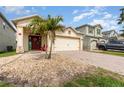 Charming single-story home featuring a two-car garage, landscaped front yard and brick paved drive at 2797 Monticello Way, Kissimmee, FL 34741