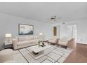 Bright living room with tile floors, ceiling fan, and neutral walls for versatile decorating at 4801 Coachmans Dr # 2, Orlando, FL 32812