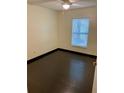 A light-filled bedroom with modern flooring and a large window providing plenty of natural light at 2740 Burwood Ave, Orlando, FL 32837