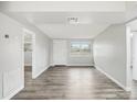 Bright and airy living room with modern gray walls, wood-look flooring, and natural light at 2943 Truman Blvd, Sanford, FL 32771