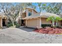 Charming home featuring a well-manicured lawn and attached two car garage at 7217 Dr Phillips Blvd, Orlando, FL 32819