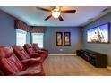 Comfortable theater room equipped with plush reclining seats and large flat screen TV at 9114 Stromboli Ct, Kissimmee, FL 34747