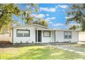 Inviting single-story home with fresh exterior paint and a neatly kept front lawn at 10526 Fernando St, Orlando, FL 32825