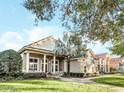 Charming single-Gathering home featuring well-manicured lawn and beautiful trees in a neighborhood setting at 10742 Boca Pointe Dr, Orlando, FL 32836