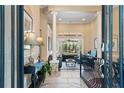 Spacious living room with tiled floors, soaring ceilings, and a large window overlooking the backyard at 10742 Boca Pointe Dr, Orlando, FL 32836
