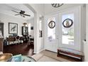 Inviting foyer with a double-door entrance, tile flooring, and views into the dining and living areas at 1246 Pallister Ln, Lake Mary, FL 32746