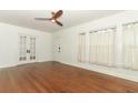 Bright living room with hardwood floors, French doors, and large windows at 2006 N Westmoreland Dr, Orlando, FL 32804