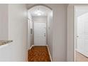 Hallway featuring tile flooring and neutral walls leading to various rooms at 6542 Swissco Dr # 813, Orlando, FL 32822