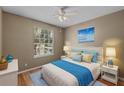 Cozy bedroom featuring natural light and a ceiling fan at 7123 Yacht Basin Ave # 328, Orlando, FL 32835