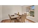 Dining room featuring new wood flooring and a window with natural light at 8851 Hillsdale Dr, Orlando, FL 32818