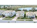 Aerial view of houses near a lake, showcasing the property's prime location and neighborhood at 9014 Sonoma Coast Dr, Winter Garden, FL 34787